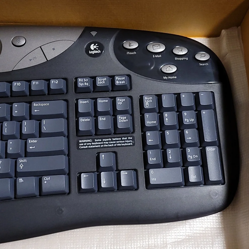 Logitech cordless freedom optical - cordless keyboard and optical mouse